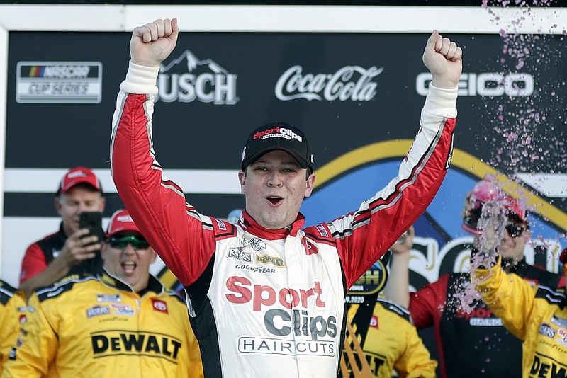 AP photo by John Raoux / Erik Jones celebrates in victory lane Sunday at Daytona International Speedway after winning the NASCAR Busch Clash exhibiton race in Daytona Beach, Fla. It took three overtimes and 88 laps to complete the event due to multiple crashes, and even Jones' car had serious damage.