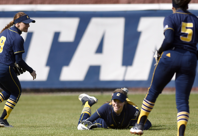 Staff Photo by Robin Rudd / UTC centerfielder Gracey Kruse (27) smiles after making a diving catch. Celebrating with Kruse are shortstop Emily Coltharp (9) and second baseman Kacie Lunch (5). The University of Tennessee at Chattanooga Mocs defeated the Austin Peay Governors in NCAA softball 9 to 1 in the first game at Jim Frost Stadium on February 9, 2020.