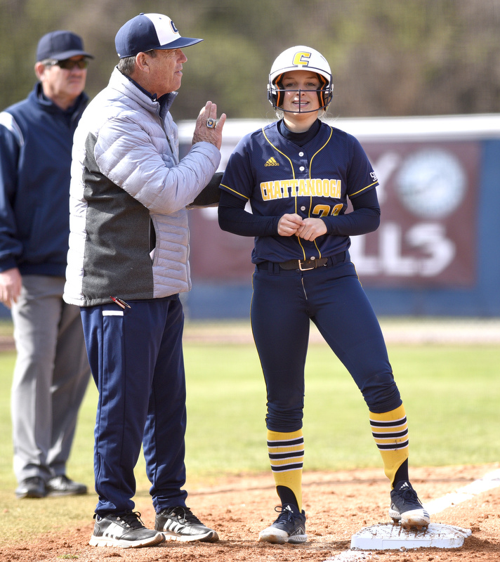 Staff Photo by Robin Rudd / UTC head coach Frank Reed instructs Sidney Swantic (22) as she stands on third. The University of Tennessee at Chattanooga Mocs defeated the Austin Peay Governors in NCAA softball 9 to 1 in the first game at Jim Frost Stadium on February 9, 2020.