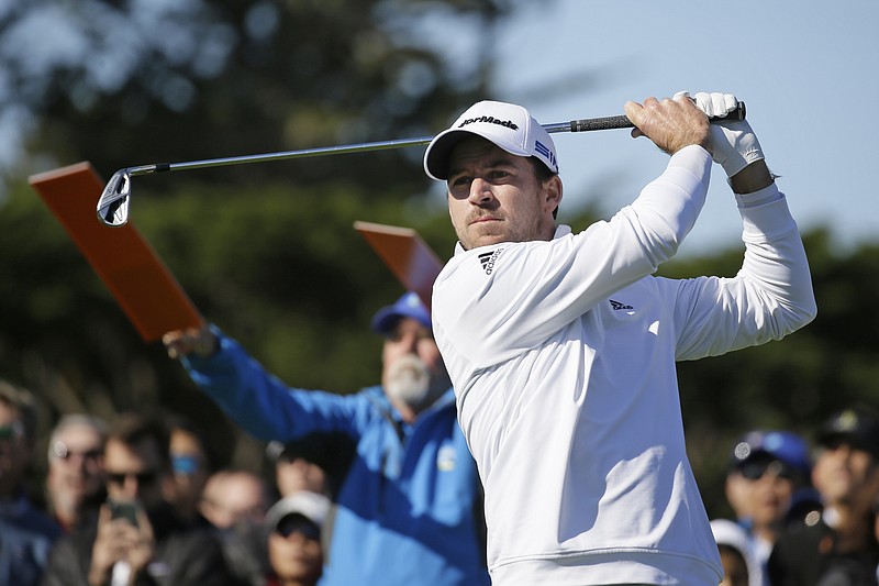 AP photo by Eric Risberg / Nick Taylor tracks his shot after teeing off on the fourth hole during Sunday's final round of the AT&T Pebble Beach Pro-Am.