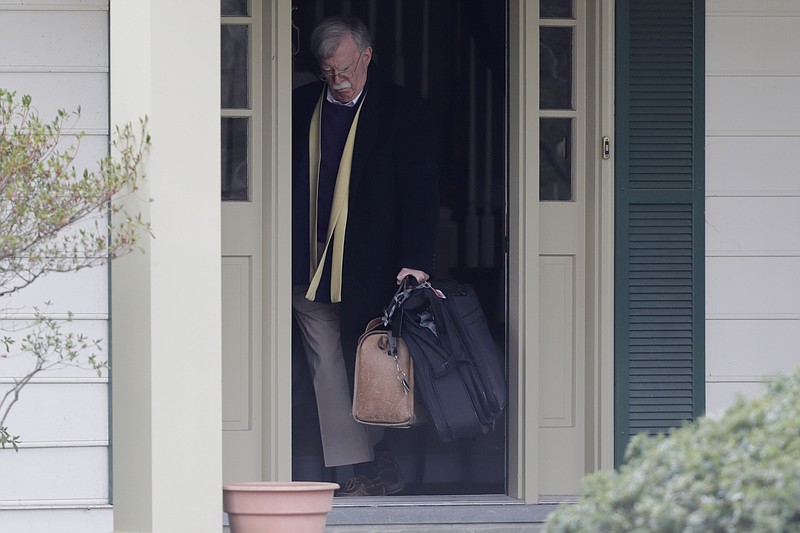 Photo by Luis M. Alvarez of The Associated Press / Former National security adviser John Bolton leaves his home in Bethesda, Maryland, on Jan. 28, 2020.