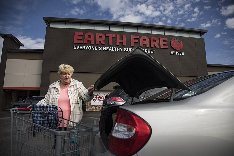 Staff photo by Troy Stolt / Earth Fare customer Paula Lay loads her groceries into her car on Monday, Feb. 3, 2020 in Chattanooga. Earth Fare is selling off its store investory and will soon close its stores on Hixson Pike in Hixson and on Gunbarrel Road in East Brainerd.