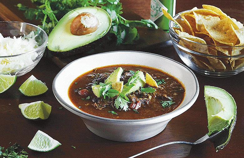 Short rib and flank steak soup sports all the luscious flavors of beefy tacos, but can be made ahead and eaten out of a bowl. / Abel Uribe/Chicago Tribune/Tribune News Service