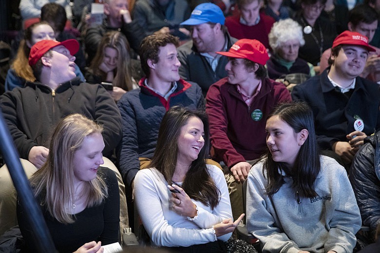 Students from local high schools and universities sit in the audience as they wait for the next speaker during the New Hampshire Youth Climate and Clean Energy Town Hall, Wednesday, Feb. 5, 2020, in Concord, N.H. (AP Photo/Mary Altaffer)