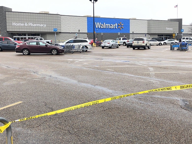 Police tape blocks off a Walmart store parking lot in Forrest City, Ark., on Monday, Feb. 10, 2020. Police say at least three people, including two officers, have been shot this Walmart in eastern Arkansas. (AP Photo/Adrian Sainz)