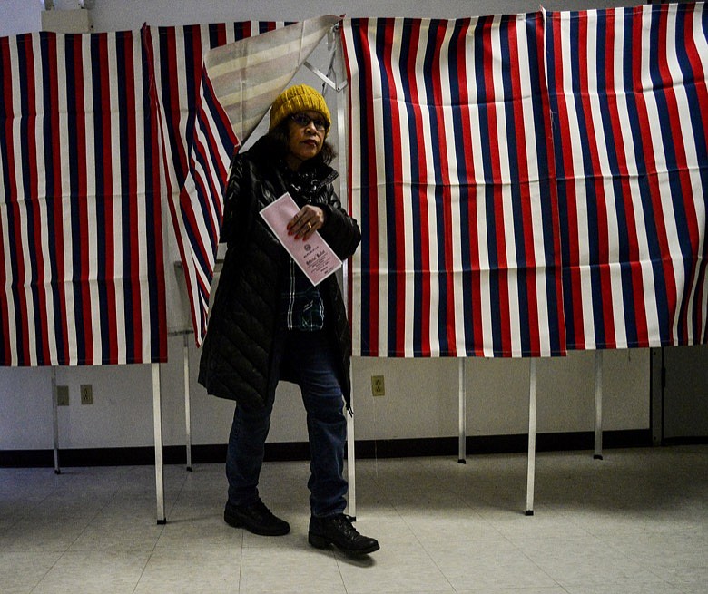 Victoria Akeley, of Hinsdale, N.H., leaves the voting booth with her ballot in hand at the Millstream Community Center during the New Hampshire presidential primary elections, Tuesday, Feb. 11, 2020. (Kristopher Radder/The Brattleboro Reformer via AP)