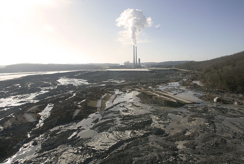 This Dec. 22, 2008, file photo shows the aftermath of a retention pond wall collapse at the TVA Kingston Fossil Plant in Harriman, Tenn. A grand jury in Tennessee's Roane County is supporting a criminal investigation into claims that a Tennessee Valley Authority contractor failed to protect workers cleaning up a massive coal ash spill. The grand jury report alludes to the workers' claims that air monitoring results and other environmental tests were tampered with by supervisors with contractor Jacobs Engineering. (AP Photo/Wade Payne, File)