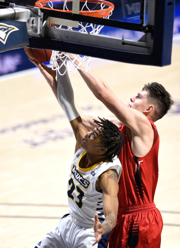 Staff Photo by Robin Rudd / UTC's Trey Doomes (23) rebounds and is fouled by VMI's Tyler Creammer (25). The University of Tennessee at Chattanooga Mocs hosted the Virginia Military Institute Keydets in Southern Conference basketball at McKenzie Area in Chattanooga, Tenn. on February 12, 2020.
