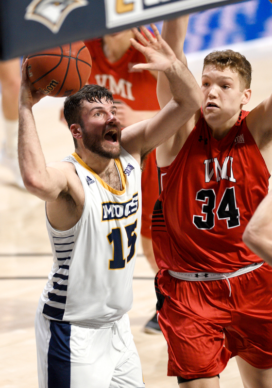 Staff Photo by Robin Rudd / UTC's Ramon Vila (15) looks to shoot inside VMI'a Jake Stephens (34). The University of Tennessee at Chattanooga Mocs hosted the Virginia Military Institute Keydets in Southern Conference basketball at McKenzie Area in Chattanooga, Tenn. on February 12, 2020.