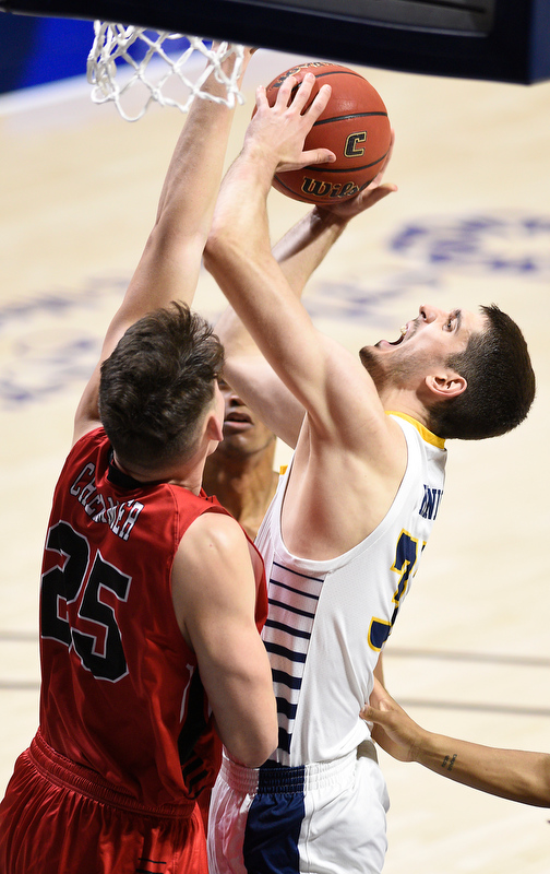 Staff Photo by Robin Rudd / UTC's Stefan Kenic (33) is fouled by VMI's Jake Stephens (34). The University of Tennessee at Chattanooga Mocs hosted the Virginia Military Institute Keydets in Southern Conference basketball at McKenzie Area in Chattanooga, Tenn. on February 12, 2020.