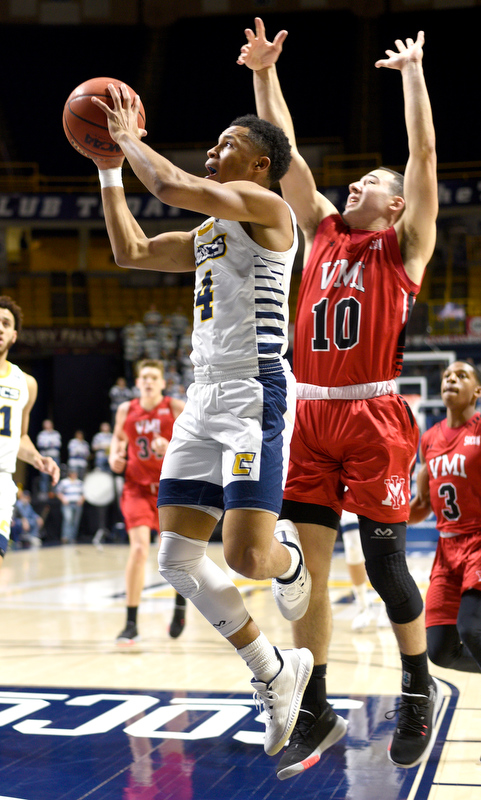 Staff Photo by Robin Rudd / UTC's Maurice Commander (4) drives to the basket past VMI's Kamdyn Curfman (10). The University of Tennessee at Chattanooga Mocs hosted the Virginia Military Institute Keydets in Southern Conference basketball at McKenzie Area in Chattanooga, Tenn. on February 12, 2020.