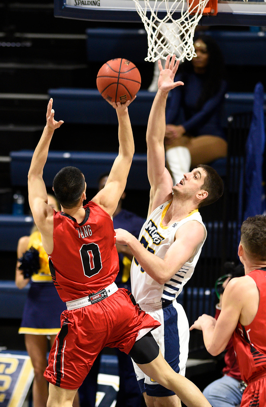 Staff Photo by Robin Rudd / UTC's Stefan Kenic (33) defends against VMI's Louis Tang (0). The University of Tennessee at Chattanooga Mocs hosted the Virginia Military Institute Keydets in Southern Conference basketball at McKenzie Area in Chattanooga, Tenn. on February 12, 2020.