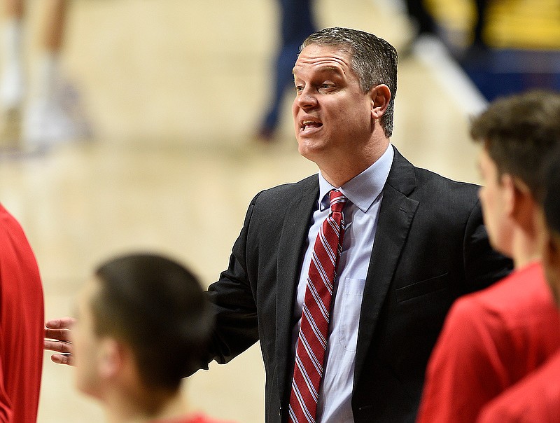 Staff photo by Robin Rudd / VMI men's basketball coach Dan Earl encourages his team during a timeout in a SoCon game against UTC on Feb. 12, 2020, at McKenzie Arena.