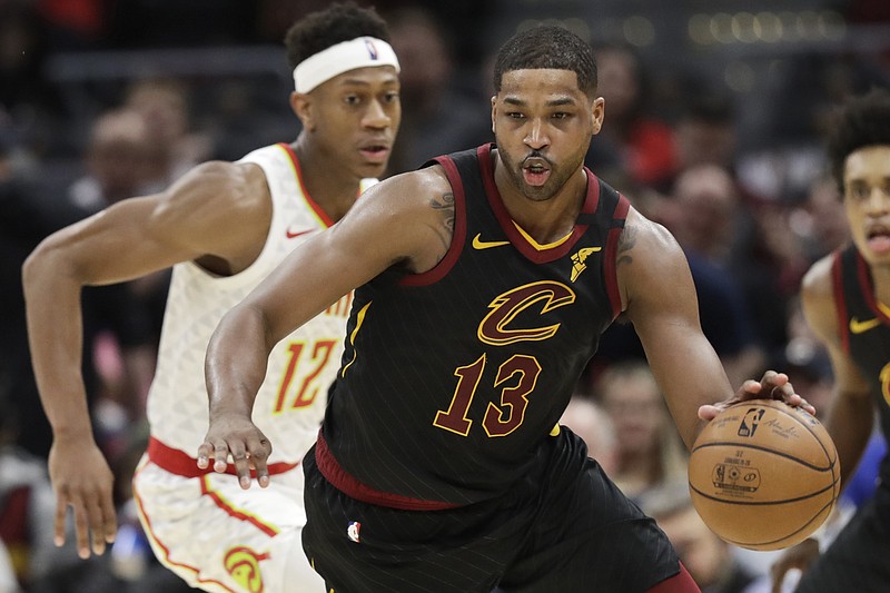 Cleveland Cavaliers' Tristan Thompson (13) drives against Atlanta Hawks' De'Andre Hunter (12) in the second half of an NBA basketball game, Wednesday, Feb. 12, 2020, in Cleveland. The Cavaliers won 127-105. (AP Photo/Tony Dejak)