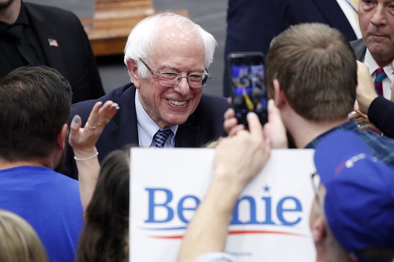 Democratic presidential candidate Sen. Bernie Sanders, I-Vt., greets supporters at a primary night election rally in Manchester, N.H., Tuesday, Feb. 11, 2020. (AP Photo/Pablo Martinez Monsivais)