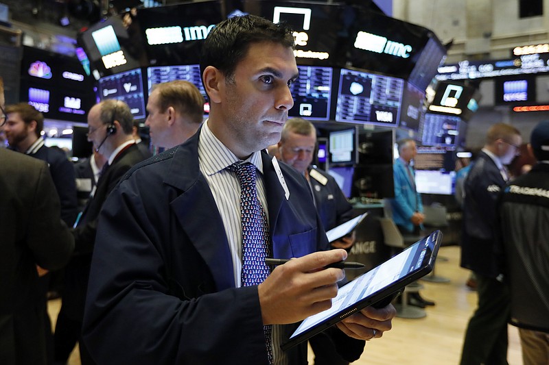 FILE - In this Feb. 6, 2020, file photo trader Craig Spector works on the floor of the New York Stock Exchange. The U.S. stock market opens at 9:30 a.m. EST on Wednesday, Feb. 12. (AP Photo/Richard Drew, File)