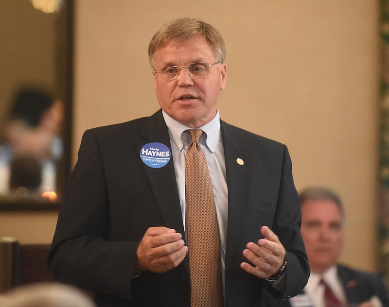 Staff File Photo / Marty Haynes, then a candidate for Hamilton County assessor of property, makes a point during a Kiwanis Club forum in 2016 at the Mountain City Club.