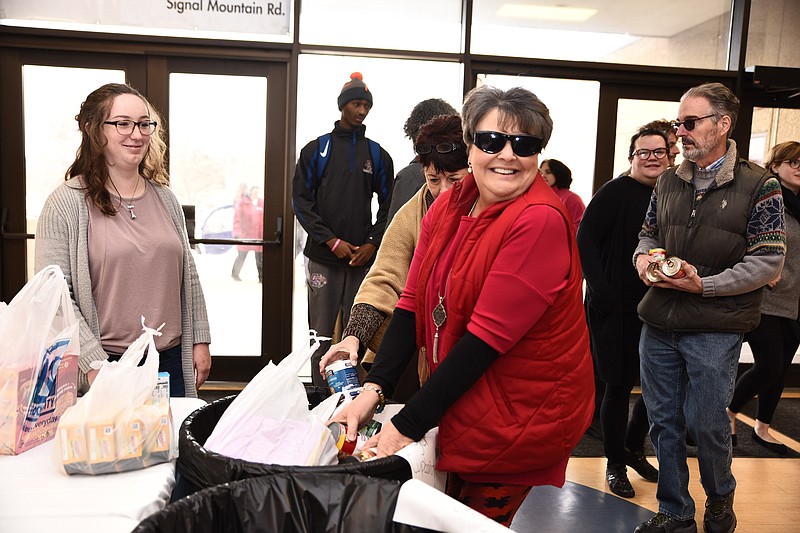 Contributed photo / Chattanooga State employees line up to drop off food items for the Tiger Cupboard food pantry during their annual holiday luncheon.