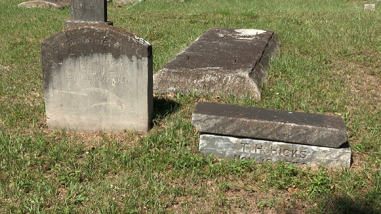 This June 27, 2019 photo, shows the grave of Caroline Hicks, at left, one of seven moved from the now-forgotten Zion Cemetery to Memorial Park, an African-American cemetery in Tampa, Fla. The Florida Senate set aside $100,000 in its budget proposal to erect memorials at Zion and Ridgewood cemeteries in Tampa. Both were African Americas cemeteries that were abandoned and in some cases the land was developed on top of burial sites.(James Borchuck/Tampa Bay Times via AP, File)/Tampa Bay Times via AP)