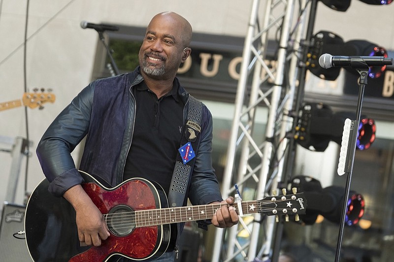 FILE - In this May 25, 2018 file photo, Darius Rucker performs on NBC's Today show at Rockefeller Plaza in New York. The Country singer couldn't quite believe it when he was surprised this week with the news that his song "Wagon Wheel" was certified eight times platinum, making it one of the top five most popular country singles ever. On Wednesday, Feb. 12, 2020, Rucker stopped by the Country Music Hall of Fame and Museum to his items in an exhibit, but his label, Universal Music Group Nashville, surprised him with a plaque featuring eight platinum-colored records. (Photo by Charles Sykes/Invision/AP, File)

