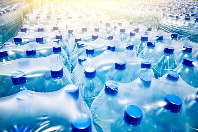 Many packaged blue mineral water bottles in stock in a store or market. water bottle tile water tile / Getty Images

