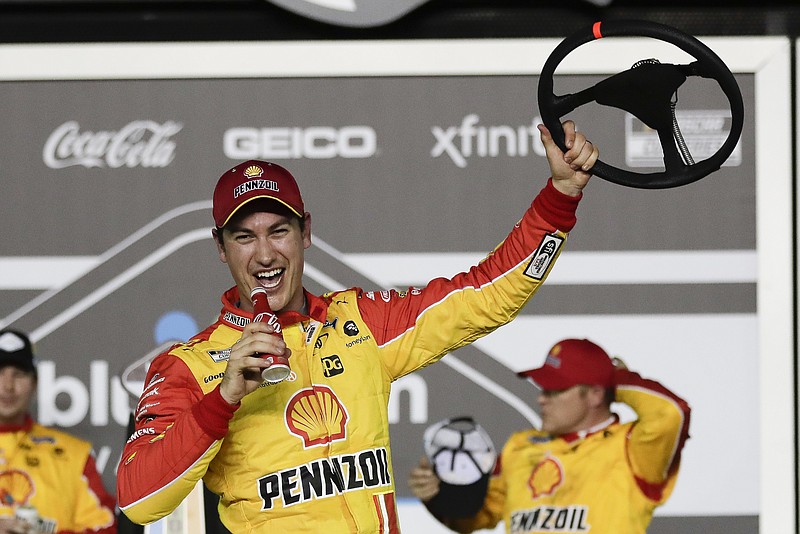 AP photo by John Raoux / Joey Logano celebrates Thursday night in victory lane at Daytona International Speedway after winning the first of the two qualifying races to set the field for this year's Daytona 500. The NASCAR Cup Series season opener is Sunday in Daytona Beach, Fla.