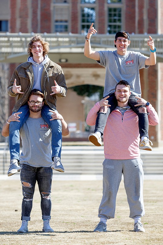 Staff photo by C.B. Schmelter / (Clockwise from top left) Piggybacks members Billy Johnston, Matt Conkel, Mac Patton and Trent Walliser pose at Chamberlain Field on the campus of the University of Tennessee at Chattanooga on Friday, Feb. 14, 2020 in Chattanooga, Tenn.