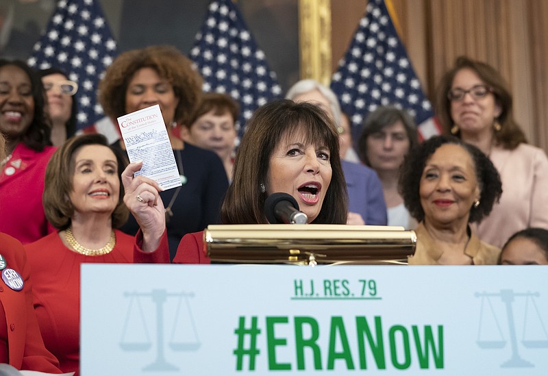 Photo J. Scott Applewhite of The Associated Press / Rep. Jackie Speier, D-California, flanked by Speaker of the House Nancy Pelosi, D-California, left, and ERA Coalition Co-President and CEO Carol Jenkins, right, holds up a copy of the Constitution during an event about their resolution to remove the deadline for ratification of the Equal Rights Amendment, at the Capitol in Washington on Feb. 12, 2020.