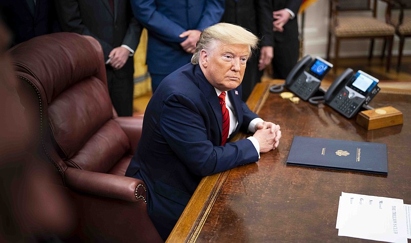 Doug Mills, The New York Times/President Donald Trump talks with reporters in the Oval Office on Tuesday, talking about his convicted friend Roger Stone.