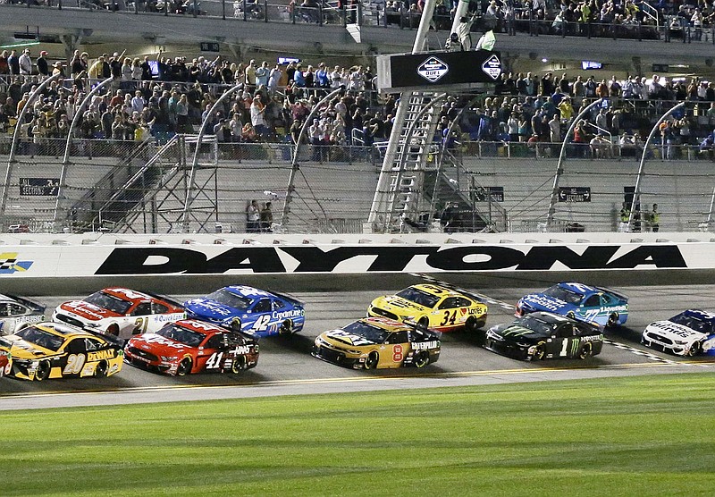 Alex Bowman (88) and Jimmie Johnson (48) lead the field to start the second of two NASCAR Daytona 500 qualifying auto races at Daytona International Speedway, Thursday, Feb. 13, 2020, in Daytona Beach, Fla. (AP Photo/Terry Renna)