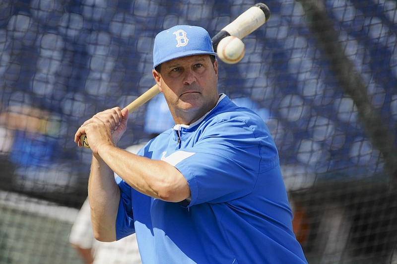 FILE - In this June 14, 2013, file photo, UCLA coach John Savage eyes the ball during NCAA college baseball practice at TD Ameritrade Park in Omaha, Neb. (AP Photo/Eric Francis, File)


