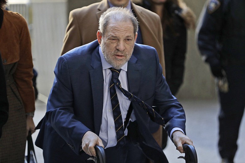 Harvey Weinstein arrives at a Manhattan courthouse for his rape trial in New York, Friday, Feb. 14, 2020. (AP Photo/Seth Wenig)