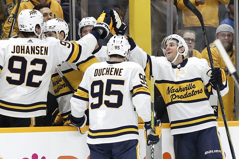 AP photo by Mark Humphrey / Nashville Predators center Kyle Turris, right, celebrates with Ryan Johansen and Matt Duchene after he scored against the St. Louis Blues during the third period of Sunday night's game in Nashville. The Predators won 2-1.