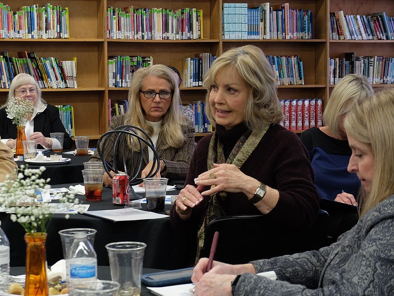 State Representative Patsy Hazelwood raises a question to Hamilton County School representatives Tuesday in a meeting with the region's state legislative delegation members at Orchard Knob Middle School, Jan. 15, 2019. State Representative Robin Smith, back center, listens to the exchange.