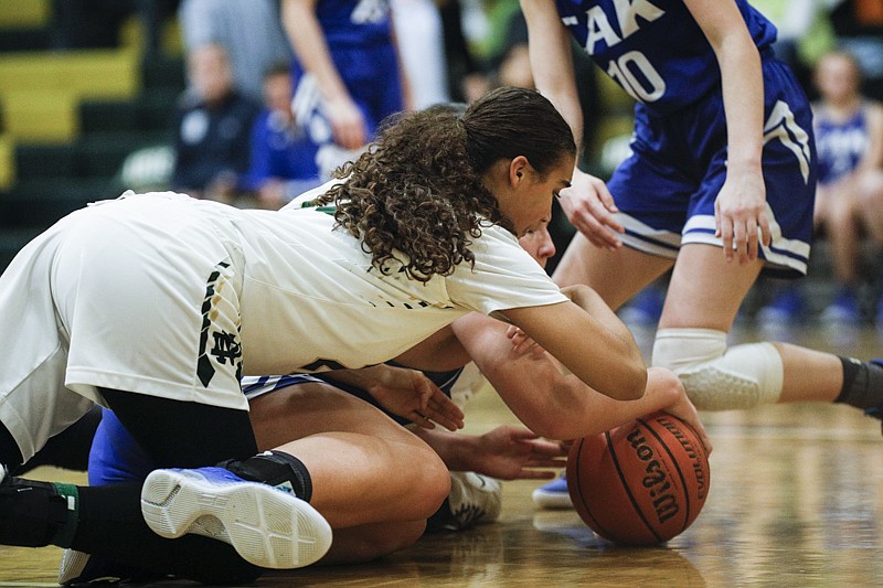 Staff photo by Troy Stolt / Notre Dame's Makyla Skaggs (22) dives on a loose ball during the Division II-A tournament quarterfinals girls basketball game between Christian Academy of Knoxville and Notre Dame on Monday, Feb. 17, 2020 in Chattanooga, Tenn.