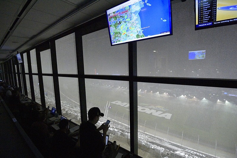 A downpour, as viewed from the press box, forces a postponement of the NASCAR Daytona 500 auto race at Daytona International Speedway, Sunday, Feb. 16, 2020, in Daytona Beach, Fla. (AP Photo/Phelan M. Ebenhack)