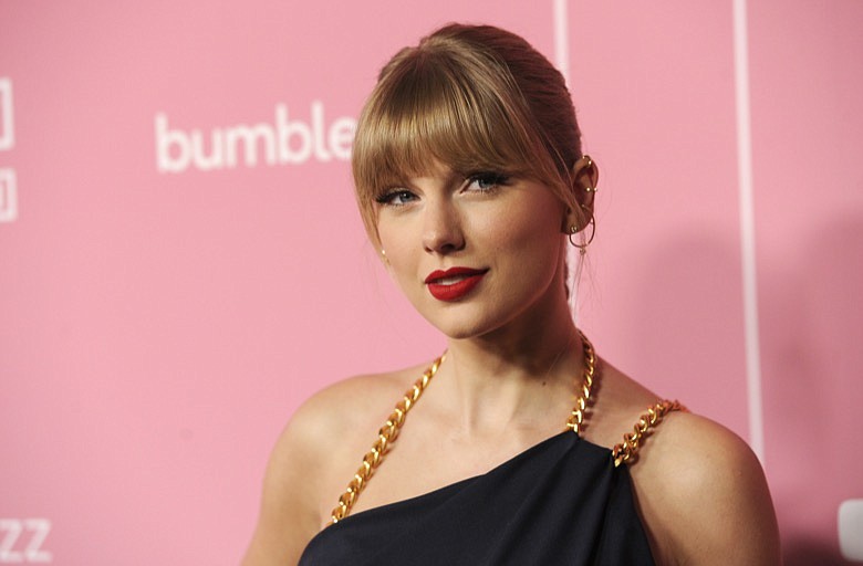 In this Dec. 12, 2019, file photo, Taylor Swift arrives at Billboard's Women in Music at the Hollywood Palladium in Los Angeles. Swift's father recently fought a burglar who broke into his $4 million Florida penthouse. The Tampa Bay Times reports that Scott Swift returned to his home in the Vinoy Place Towers on Jan. 17, 2020, just moments after 30-year-old Terrence Hoover used an emergency stairwell to climb 13 floors to enter it. (AP Photo/Chris Pizzello, File)