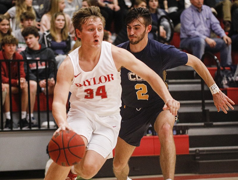 Staff photo by Troy Stolt / Baylor's Gehrig Ebel (34) drives to the basket during the first half of the boys basketball game between Chattanooga Christian and Baylor on Tuesday, Feb. 18, 2020 in Chattanooga, Tenn.