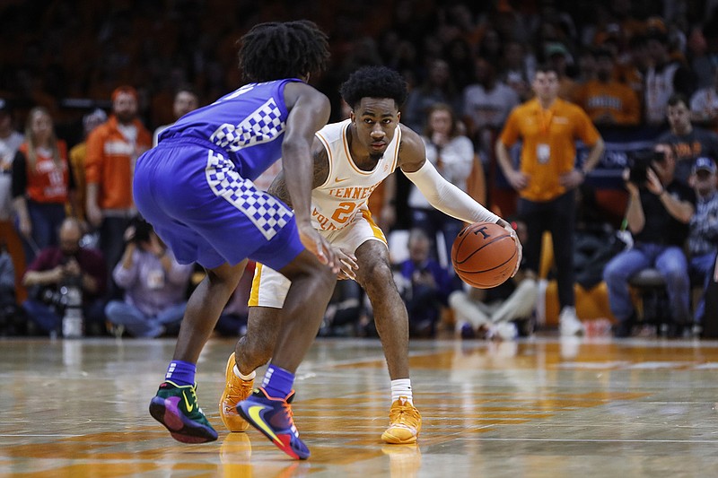 AP photo by Wade Payne / Tennessee senior Jordan Bowden dribbles while guarded by Kentucky's Immanuel Quickley on Feb. 8 in Knoxville. Bowden is shooting just 36.7% from the field and 26.4% from 3-point range this season, but he remains in the starting lineup because he is still contributing points and helping the team in other ways.