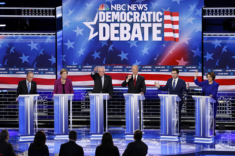 From left, Democratic presidential candidates, former New York City Mayor Mike Bloomberg, Sen. Elizabeth Warren, D-Mass., Sen. Bernie Sanders, I-Vt., former Vice President Joe Biden, former South Bend Mayor Pete Buttigieg, Sen. Amy Klobuchar, D-Minn., participate in a Democratic presidential primary debate Wednesday, Feb. 19, 2020, in Las Vegas, hosted by NBC News and MSNBC. (AP Photo/John Locher)