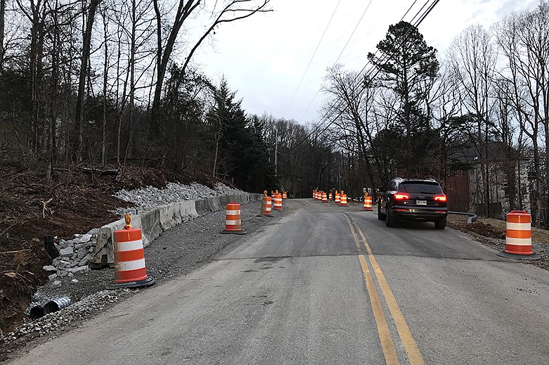 Reflective barrels are seen lining Sunset Drive on Signal Mountain February 19, 2020. Hamilton County Emergency Management has been watching the road with seismic monitors since last week, and one homeowner has been evacuated until a structural engineer declares it safe for occupation. / Staff photo by Emily Crisman