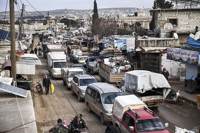 Civilians flee from Idlib toward the north to find safety inside Syria near the border with Turkey, Saturday, Feb. 15, 2020. Syrian troops are waging an offensive in the last rebel stronghold. (AP Photo)