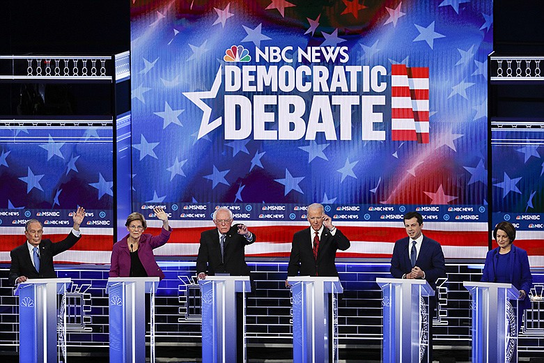 From left, Democratic presidential candidates, former New York City Mayor Mike Bloomberg, Sen. Elizabeth Warren, D-Mass., Sen. Bernie Sanders, I-Vt., former Vice President Joe Biden, former South Bend Mayor Pete Buttigieg, Sen. Amy Klobuchar, D-Minn., participate in a Democratic presidential primary debate Wednesday, Feb. 19, 2020, in Las Vegas, hosted by NBC News and MSNBC. (AP Photo/John Locher)