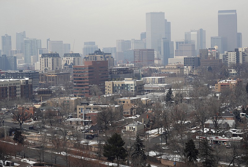 Photo by David Zalubowski of The Associated Press / As traffic rolls along Speer Boulevard in Denver, Colorado, the skyline is shrouded as pollution fills the air Wednesday, March 6, 2019.