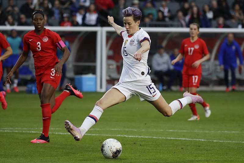 AP photo by Chris Carlson / U.S. forward Megan Rapinoe scores against Canada during an Olympic qualifying match against Canada on Feb. 9 in Carson, Calif. The U.S. women's national soccer team is suing the country's soccer federation in a gender discrimination lawsuit.