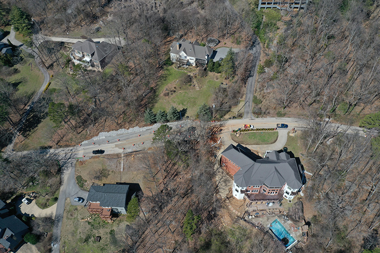 Photo Provided Courtesy of 148 Films by Skip Skipper / This aerial photograph shows a cluster of homes in an area along the 1300 block of Sunset Drive on Signal Mountain where Emergency Management officials say a shifting shelf has endangered the structural integrity of at least one home.