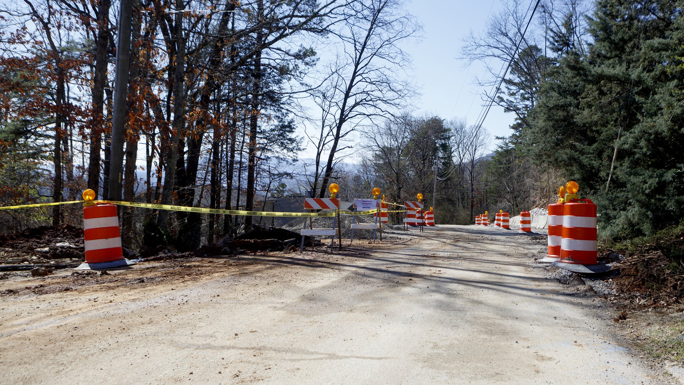 Staff photo by C.B. Schmelter / Traffic cones and traffic tape are seen along Sunset Drive on Friday, Feb. 21, 2020 in Signal Mountain, Tenn. Recent rains have cause the ground under the road to shift.