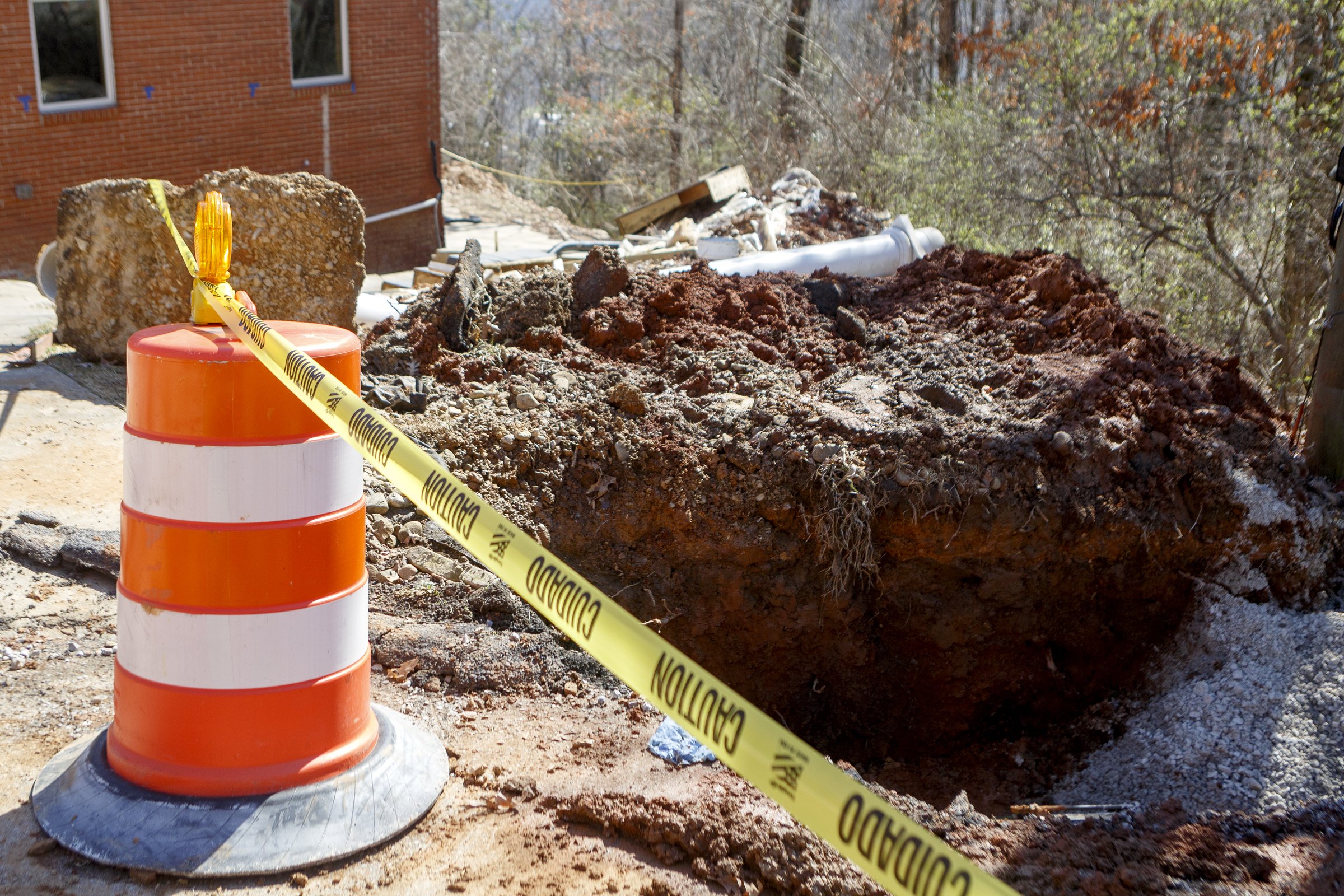 Staff photo by C.B. Schmelter / Damage due to shifting ground caused by recent rains is seen along Sunset Drive on Friday, Feb. 21, 2020 in Signal Mountain, Tenn.