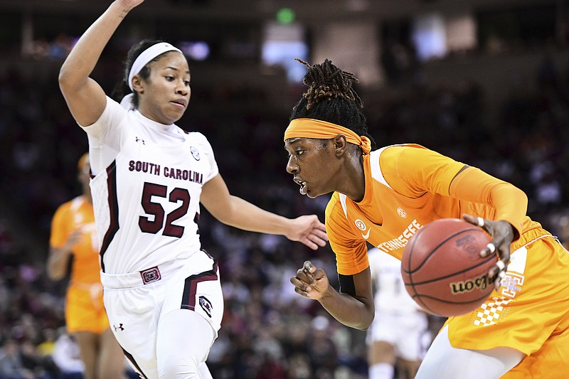 AP photo by Sean Rayford / Tennessee's Rennia Davis drives past South Carolina's Tyasha Harris on Feb. 2 in Columbia, S.C. Davis has averaged 18.1 points per game this season as the Lady Vols' most reliable player, with her consistency a big factor in keeping their NCAA tournament hopes alive.