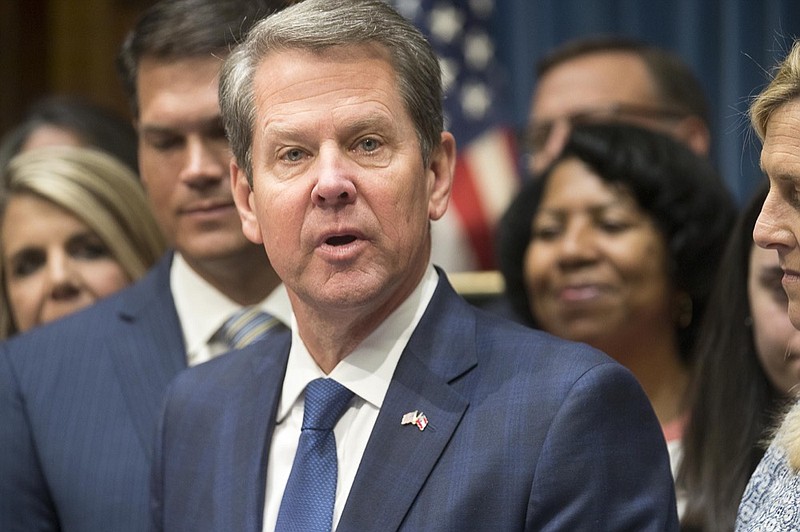 FILE- In this May 7, 2019, file photo, Georgia Gov. Brian Kemp speaks during a press conference for the signing of HB 481 at the Georgia State Capitol building in Atlanta. (Alyssa Pointer/Atlanta Journal-Constitution via AP, File)


